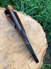 Image shows the side and burnished welt of the custom leather sheath for the Mora Kansbol or Garbeg with the knife in situ