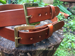 Hand sewn leather belt with a brass buckle