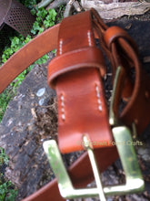 Hand sewn leather belt with a brass buckle