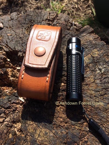 A hand-made leather belt pouch to fit the Olight S2 or S2R Baton torch.